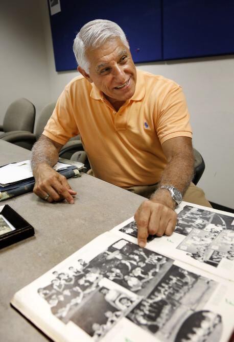 
Al Martínez, pointing out his photo in a 1955 yearbook from a school in Cuba, was 13 when...