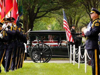 The Dallas Police Color Guard (left) enters the Garden of Honor as it escorted the...