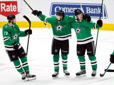 Dallas Stars left wing Jason Robertson (21) is congratulated by his teammates after scoring a third period goal against the Columbus Blue Jackets at the American Airlines Center in Dallas, Thursday, March 4, 2021. The Stars fell though to the Blue Jackets, 3-2.