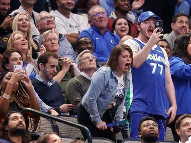 Dallas Mavericks fans cheer and chant “OBJ” as NFL free agent Odell Beckham Jr. is shown...