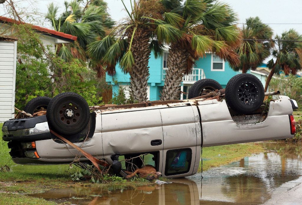 A truck is flipped over after Hurricane Harvey landed in the Coast Bend area on Saturday, Aug. 26, 2017, in Port Aransas, Texas. The National Hurricane Center has downgraded Harvey from a Category 1 hurricane to a tropical storm. Harvey came ashore Friday along the Texas Gulf Coast as a Category 4 storm with 130 mph winds, the most powerful hurricane to hit the U.S. in more than a decade. 