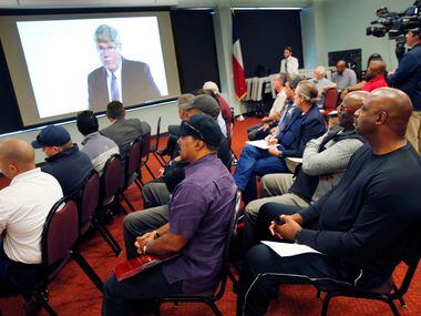 Dallas Police and Fire Pension System members watch a series of videos created to help...