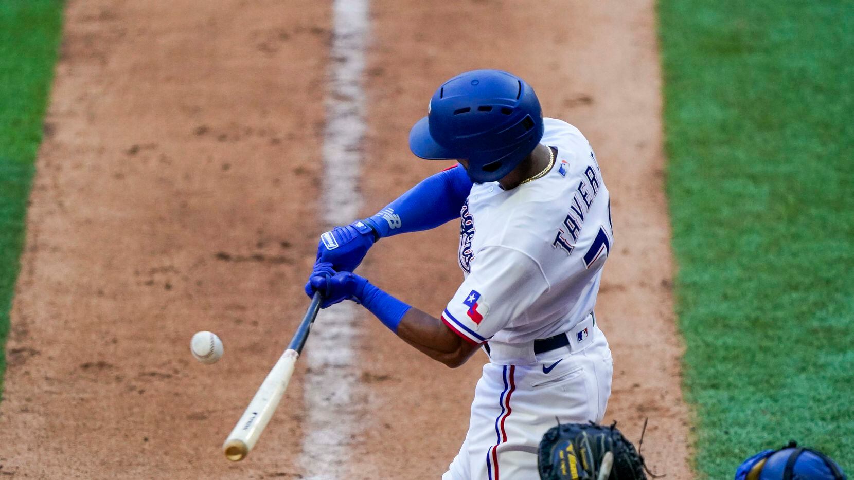 Outfielder Leody Taveras bats in an intrasquad game during Texas Rangers Summer Camp at...