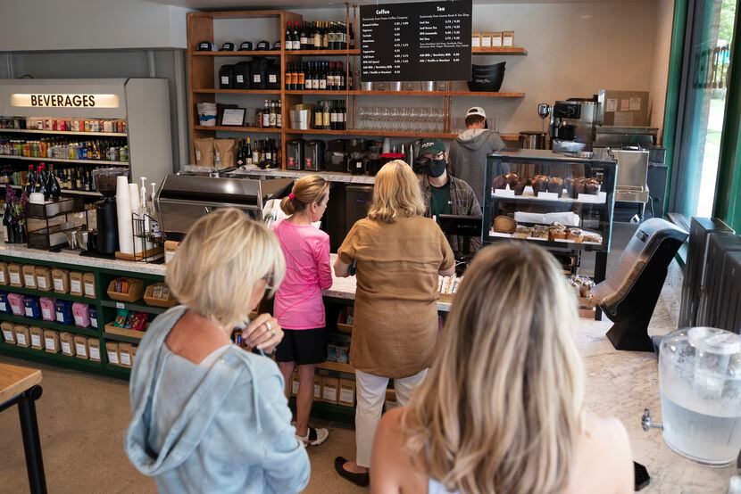 Customers wait to order at the new coffee shop and wine bar.