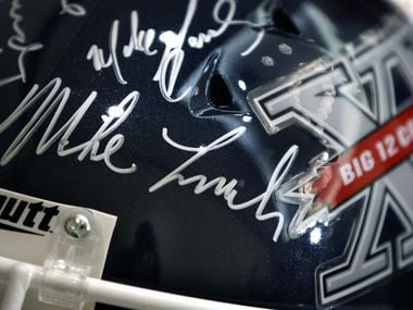 July 29, 2009: A football helmet on display during Big 12 Media Days bears the signature of Mike Leach and other conference coaches.