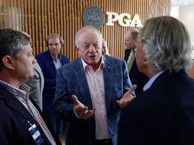 Dallas Cowboys owner and general manager Jerry Jones (center) talks to PGA’s John...