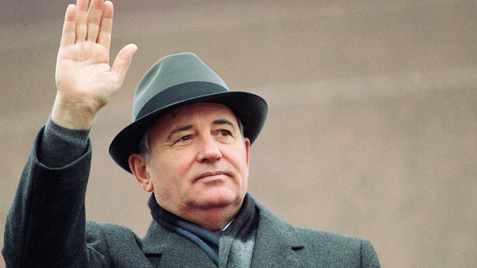 FILE - Soviet President Mikhail Gorbachev waves from the Red Square tribune during a...