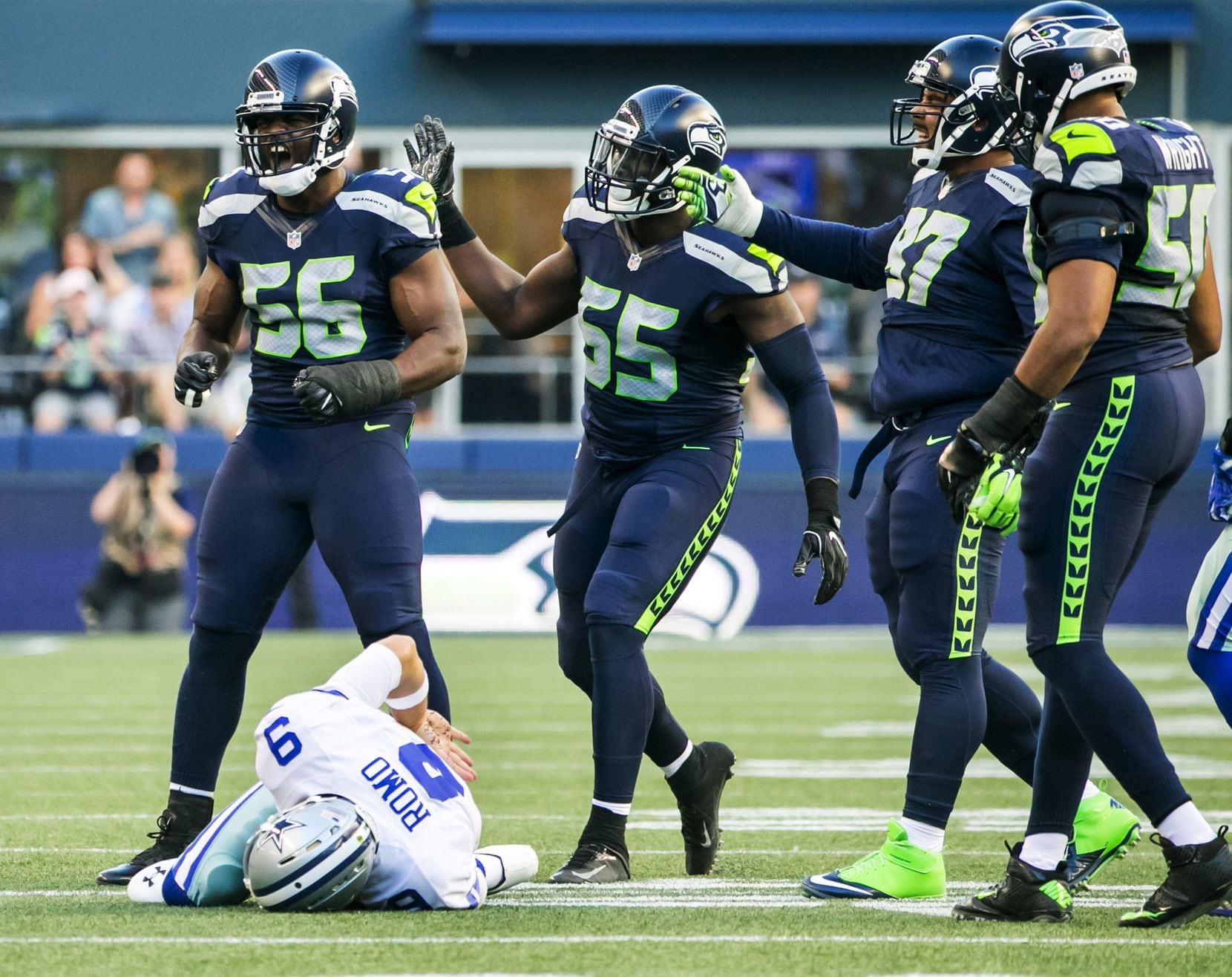 Seahawks defensive lineman Cliff Avril celebrates his sack on Cowboys quarterback Tony Romo...