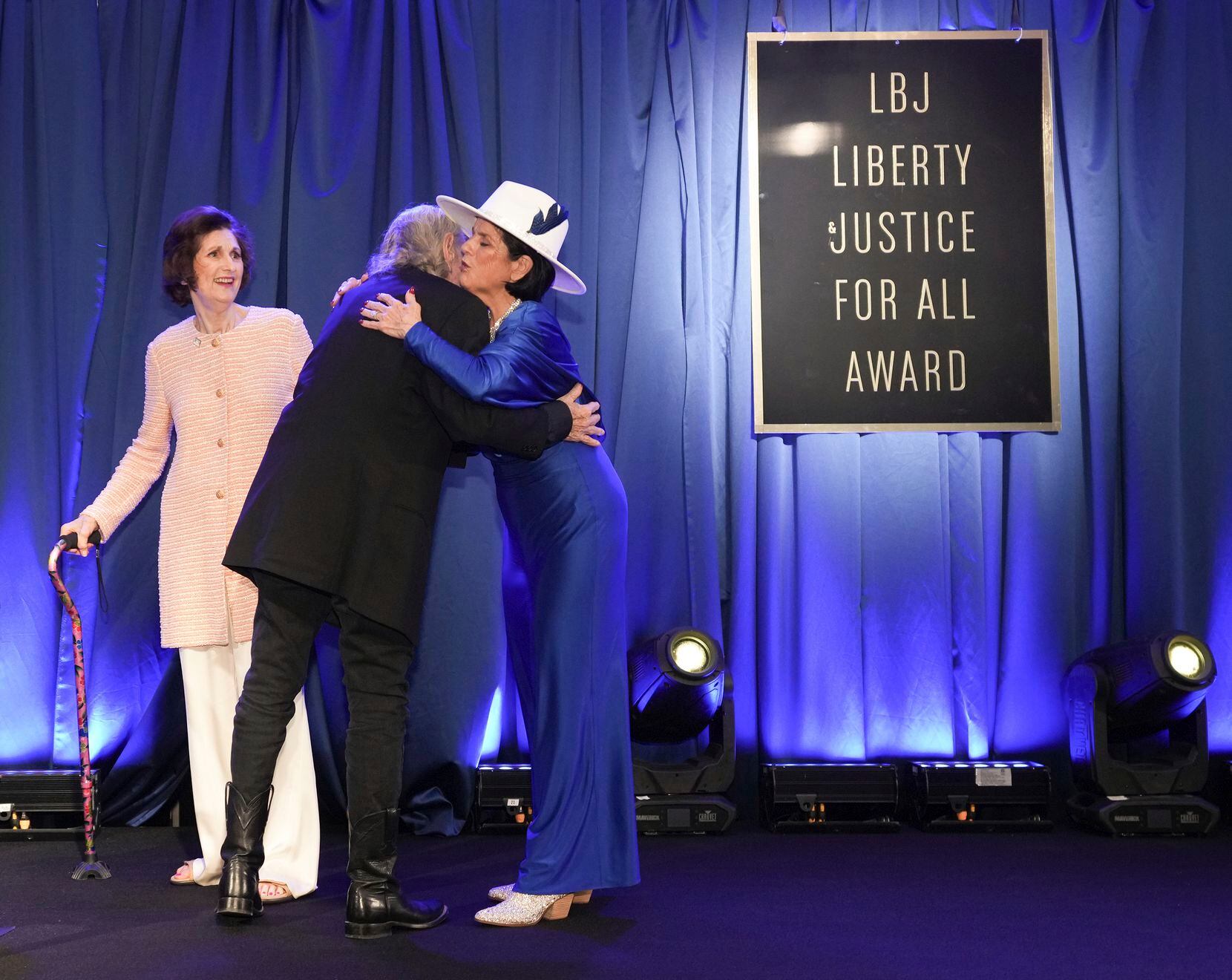 Willie Nelson receives the LBJ Liberty and Justice For All Award from Lynda Bird Johnson...