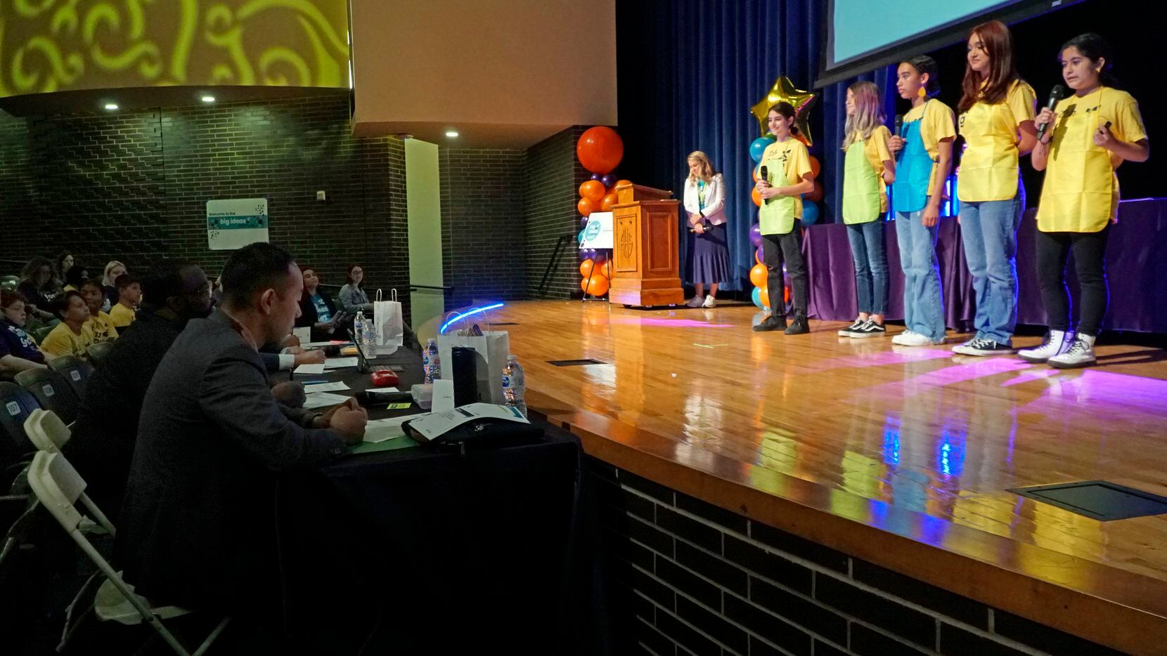 Finalists from Robert T. Hill Middle School pitched their business during the finals for the...