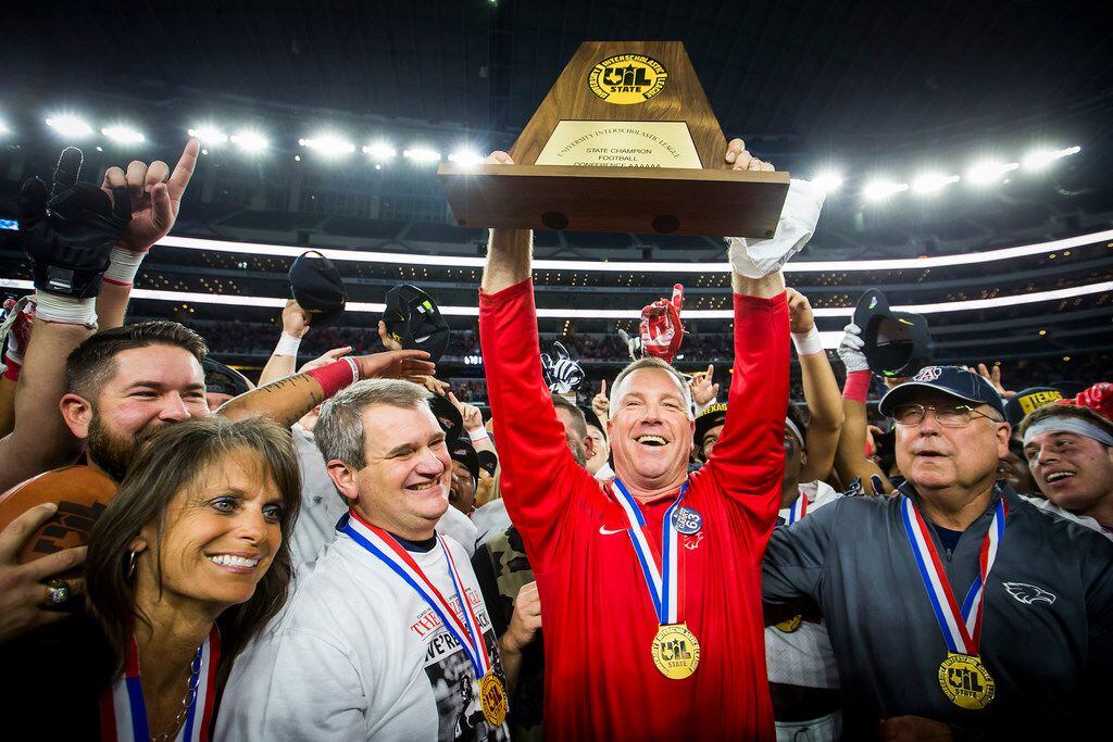 Allen head coach Terry Gambill head coach Terry Gambill hoists the championship trophy after the Eagles 35-33 victory over Lake Travis in the Class 6A Division I state championship game at AT&T Stadium on Saturday, Dec. 23, 2017, in Arlington, Texas. (Smiley N. Pool/The Dallas Morning News)