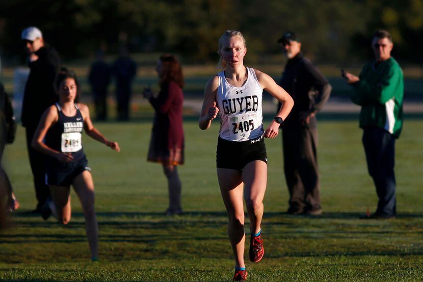 Denton Guyer's Brynn Brown (2405) races to victory in the District 5-6A cross country meet...