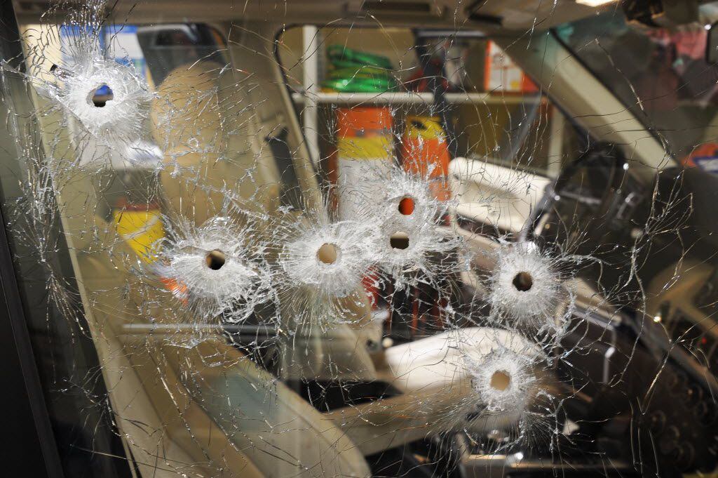 Bullet holes dot the passenger side of the victim's Range Rover. Juan Jesus Guerrero Chapa,...