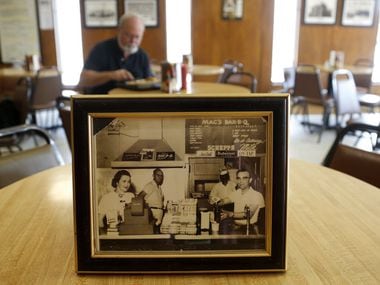 1957 photo of Effie White (left), Bill H. McDonald, Mr. Charlie and Mr. Brown at a former location, pictured at the current location of Mac's Bar-B-Que. (File Photo/The Dallas Morning News)