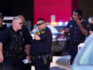 Dallas police works the scene of a shooting at Dallas Love Field Airport on Monday, July 25,...