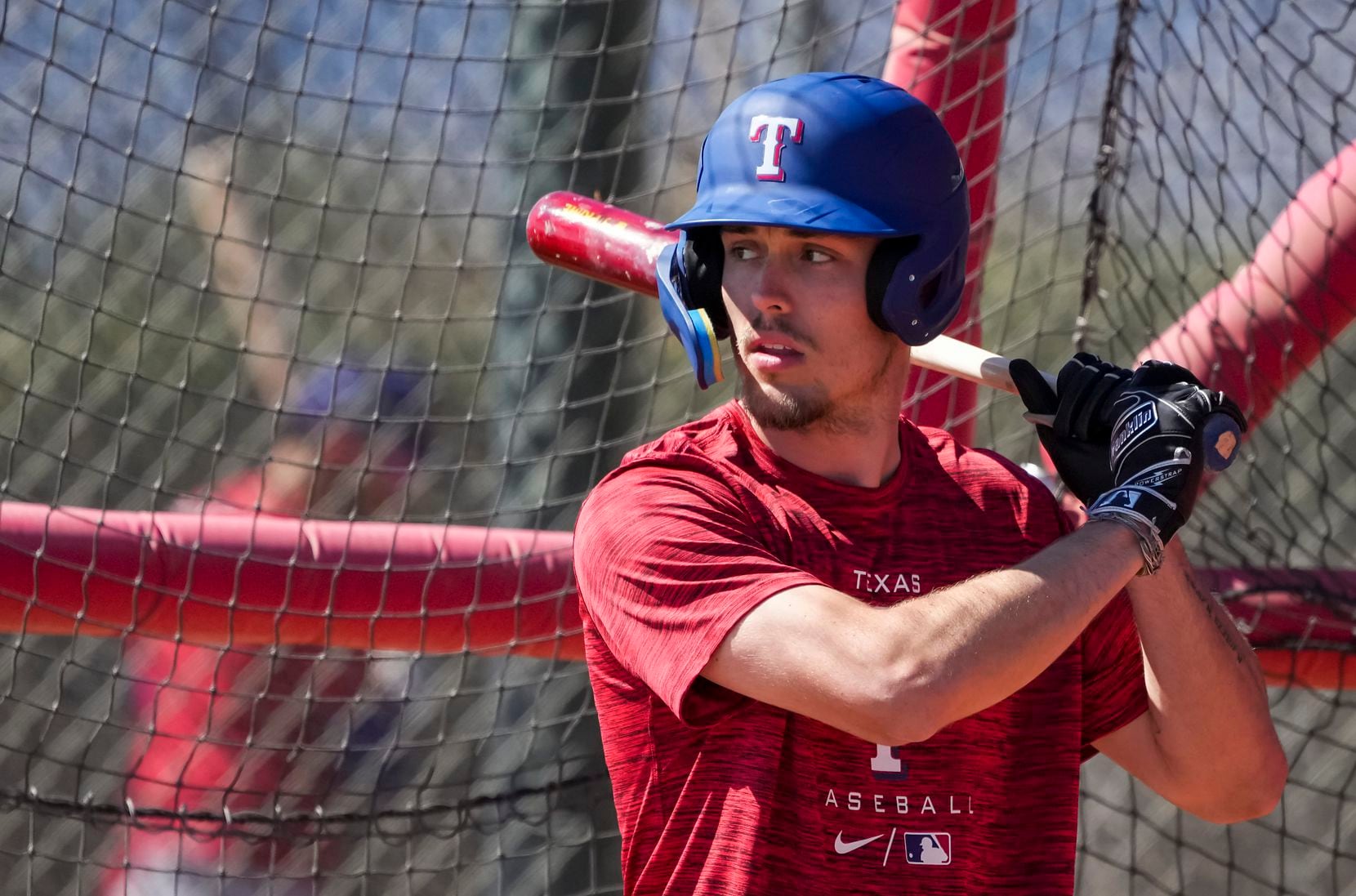 Outfielder Evan Carter takes batting practice during a Texas Rangers minor league spring...