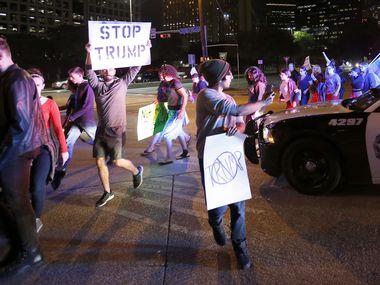 Protesters against President-elect Donald Trump march in downtown Dallas, Thursday, Nov. 10,...