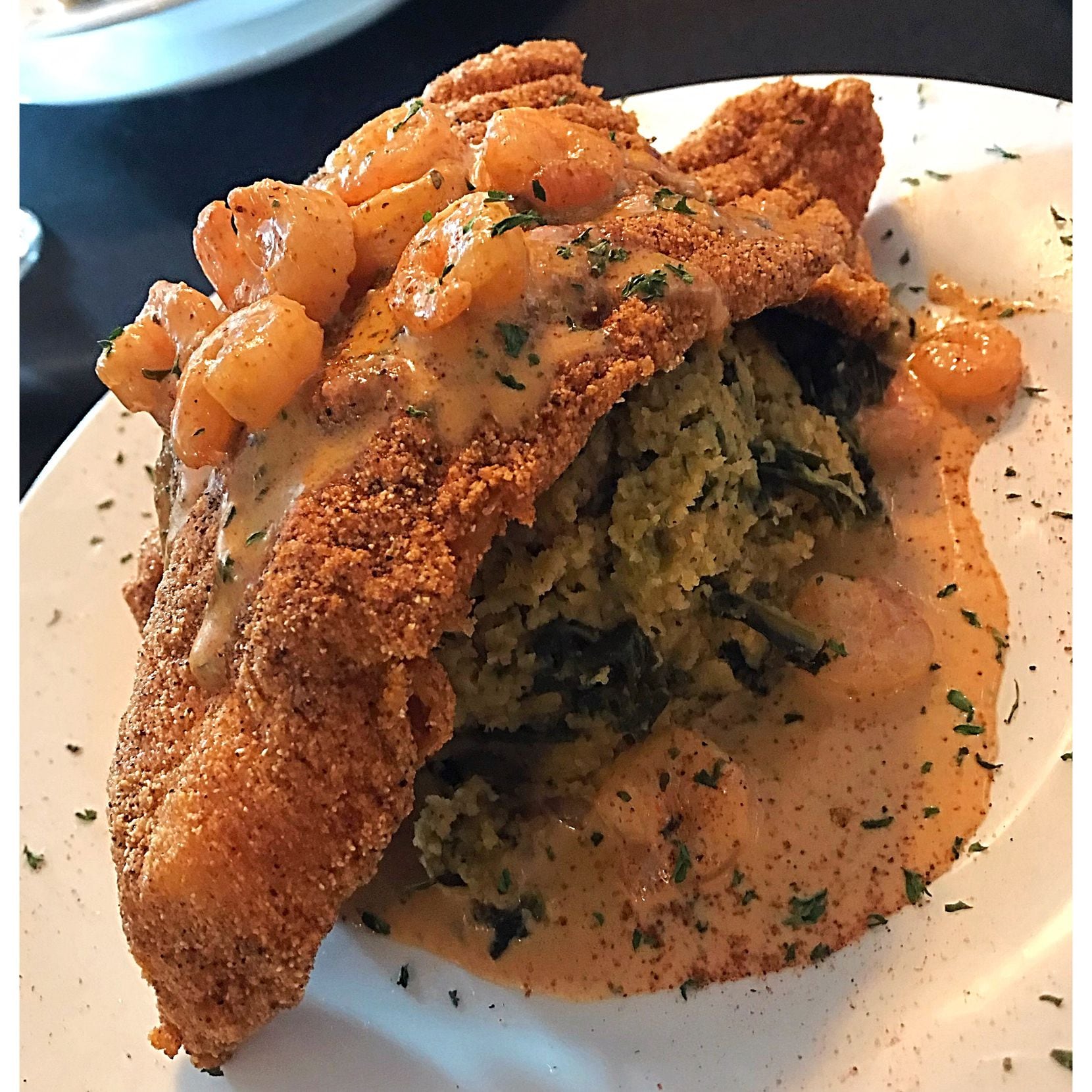 The "All Tyed Up" at Ten Eleven Grill features cornbread dressing, shrimp and deep-fried...