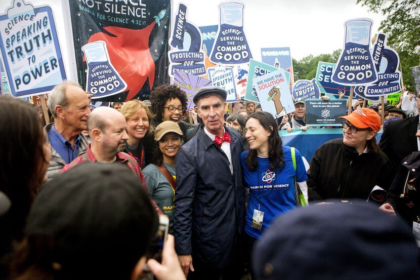 Bill Nye the Science Guy arrives to lead scientists and supporters down Constitution Avenue...