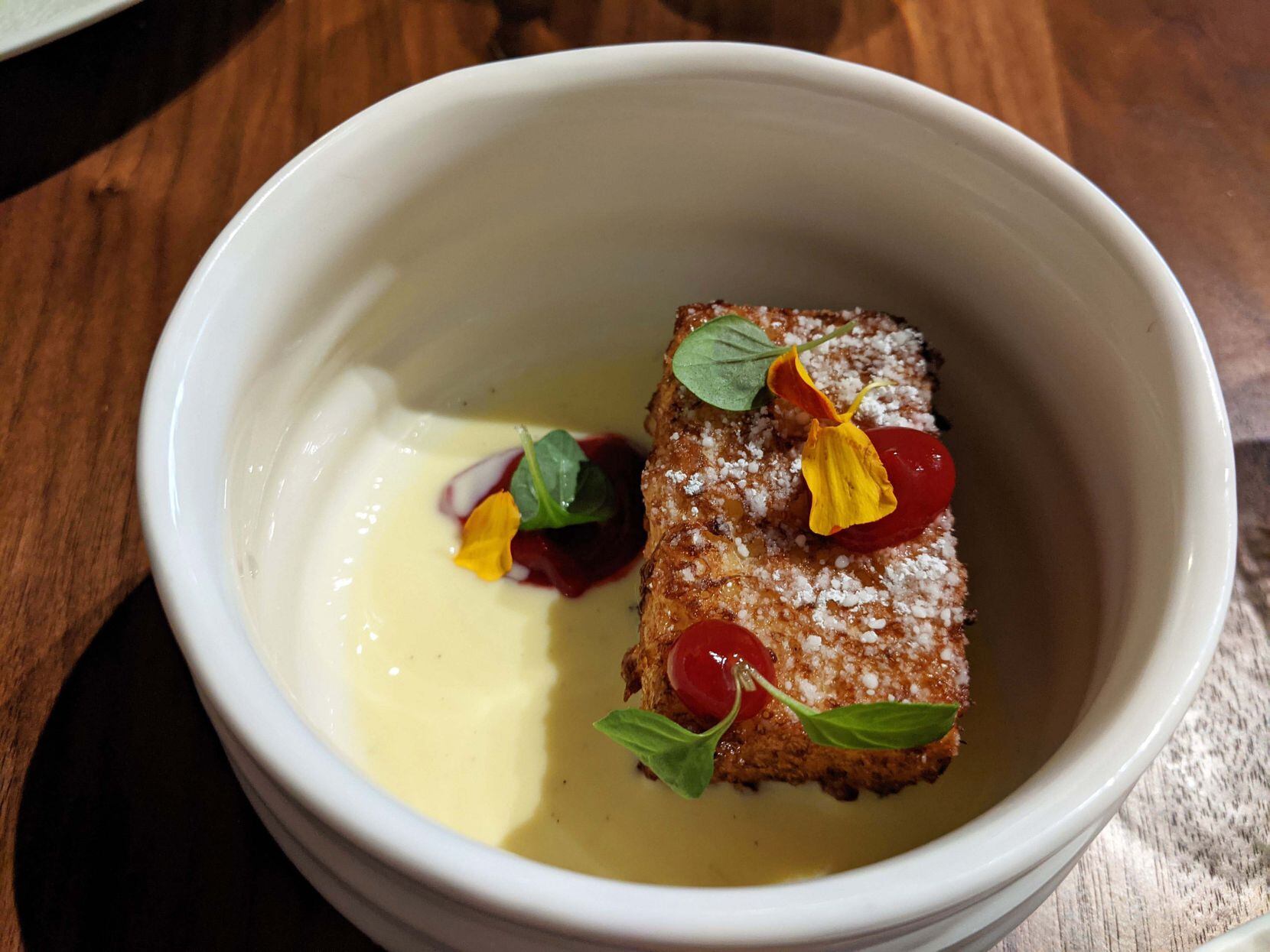 Carte Blanche's passion fruit French toast, which our reviewer said tasted like a funnel cake.