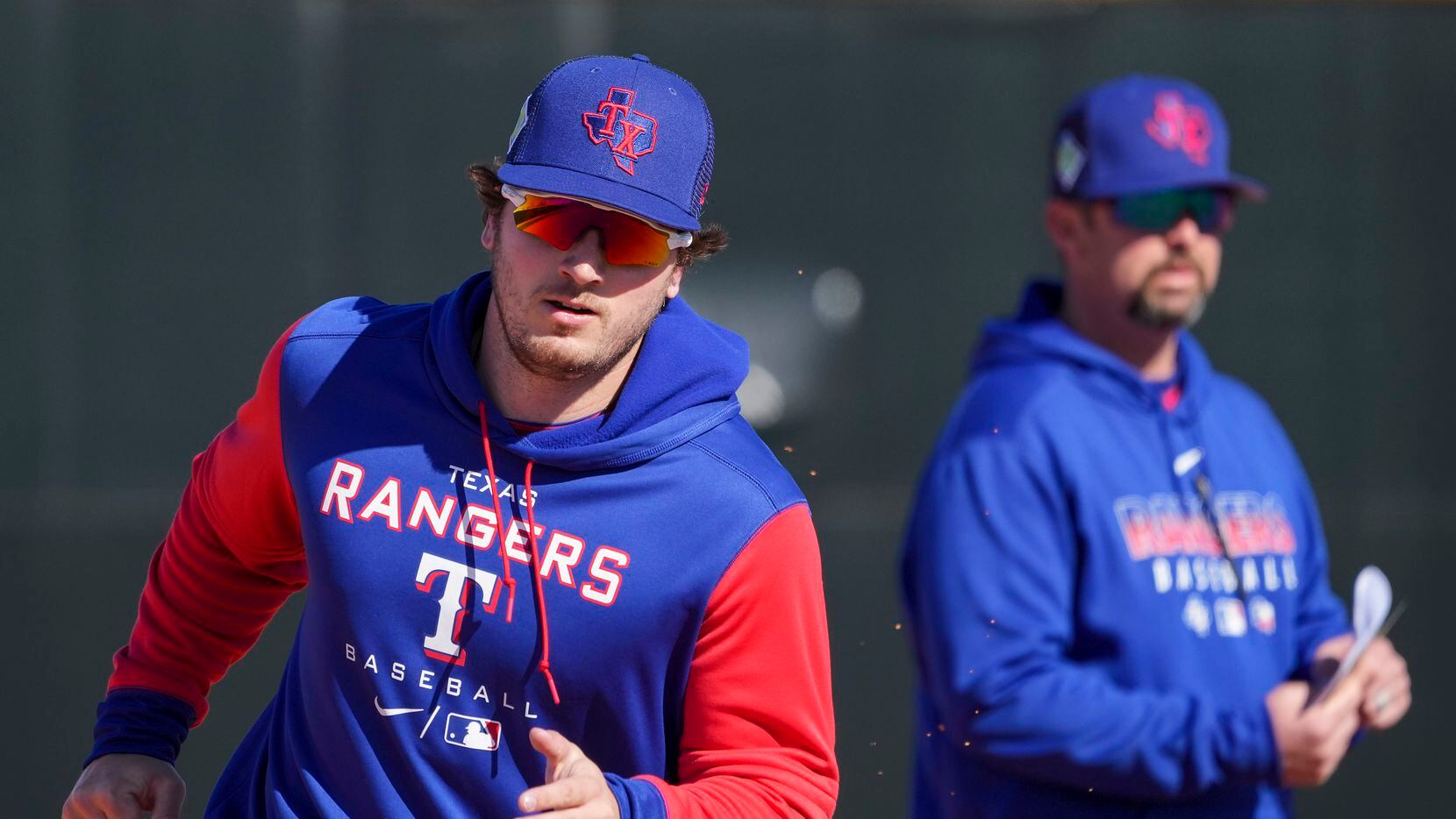 Outfielder Trevor Hauver participates in a base running drill during a Texas Rangers minor...