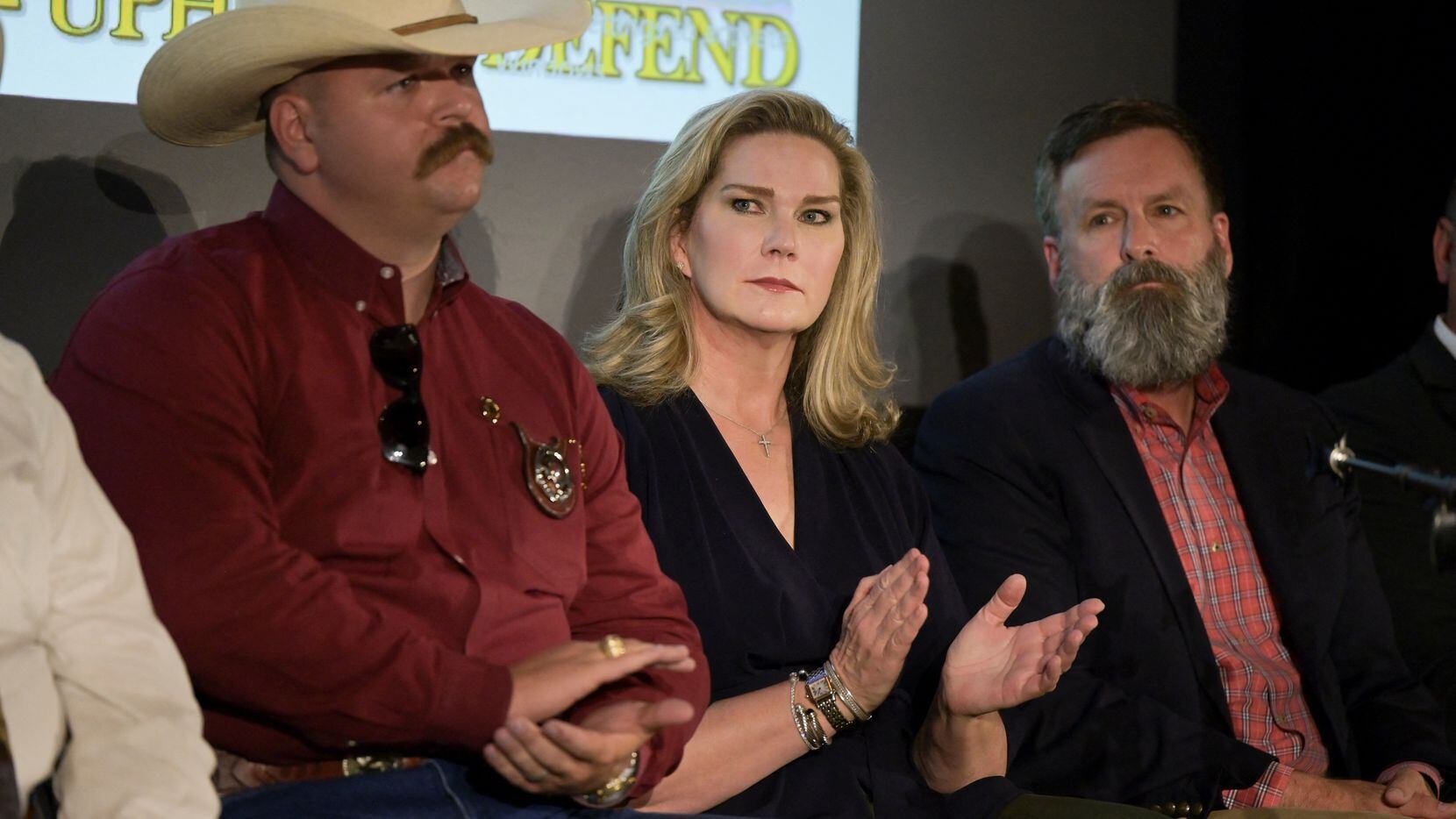Catherine Engelbrecht, founder of True the Vote, applauds during a news conference in Las...