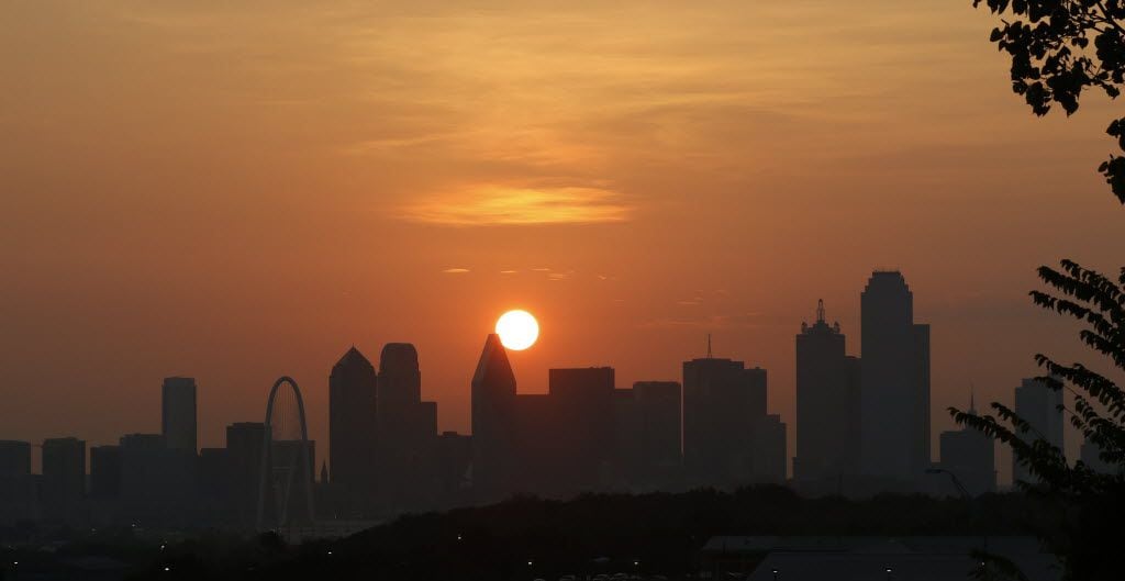 The sun rises over the Dallas skyline in a file photo. Hospitals are gearing up as...
