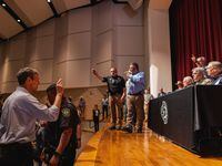 Democratic gubernatorial candidate Beto O'Rourke interrupts a press conference held by Texas...