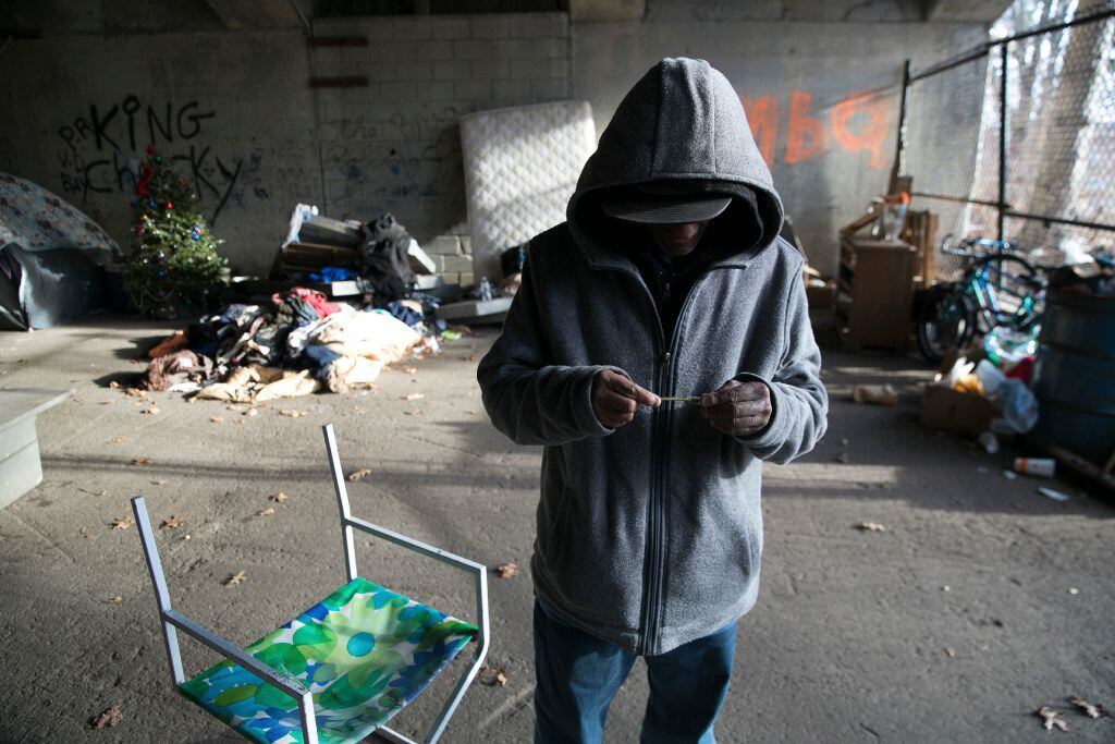 A man who is addicted to heroin and the opioid fentanyl is pictured in a tent city along the...