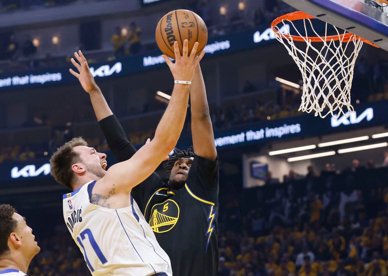 Dallas Mavericks guard Luka Doncic (77) attempts a shot as Golden State Warriors center...