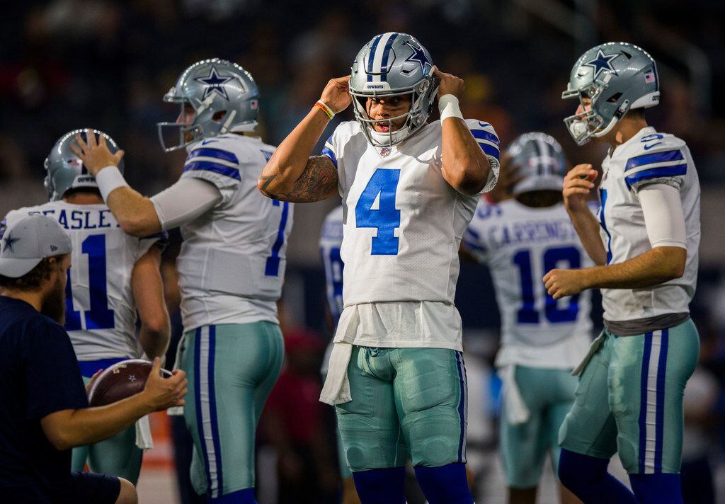 Dallas Cowboys quarterback Dak Prescott (4) warms up before an NFL preseason game between...