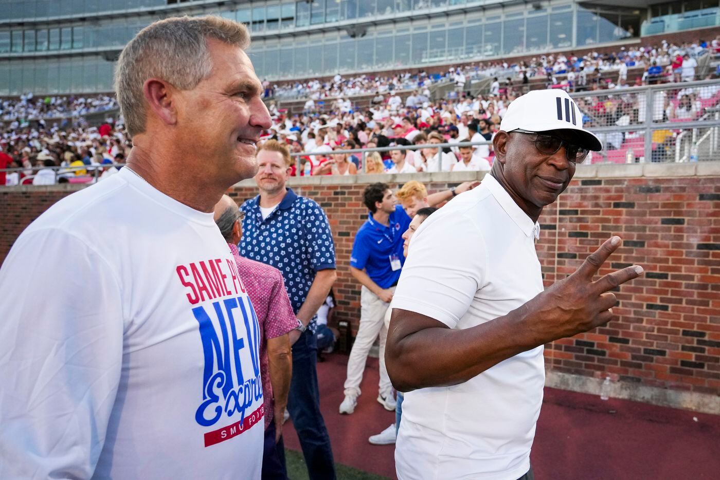 Members of the famed SMU Pony Express backfield, Eric Dickerson (right) and Craig James...