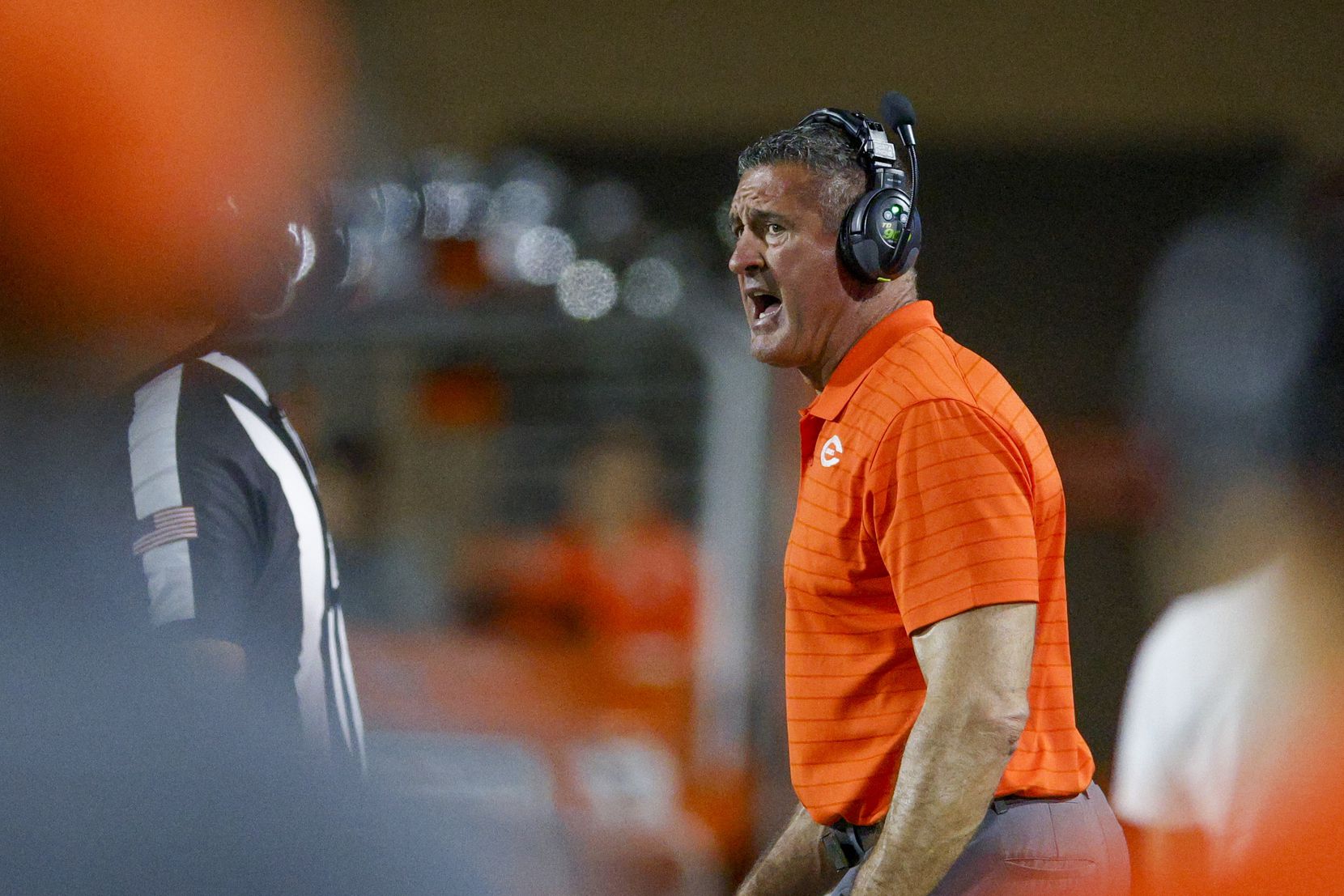Celina head coach Bill Elliott coaches from the sideline during the second half of their...