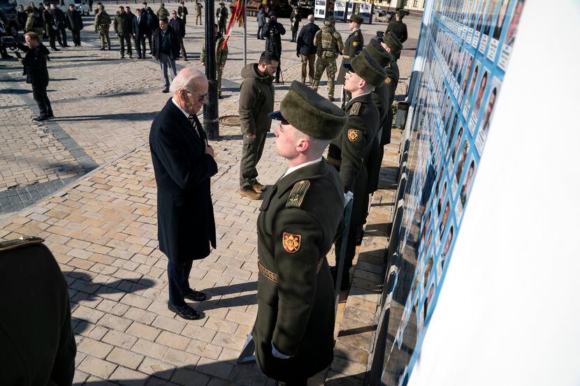 President Joe Biden, left, participates in a wreath-laying ceremony with Ukrainian President...
