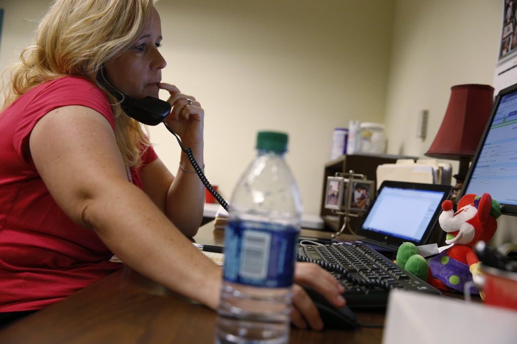CPS investigator Kelli Bailey of Fort Worth, shown at her office last June. (Nathan...