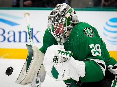Dallas Stars goaltender Jake Oettinger make a save during the second period of an NHL hockey...