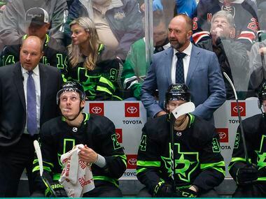 Dallas Stars head coach Peter DeBoer stands on the bench during the first period of an NHL...