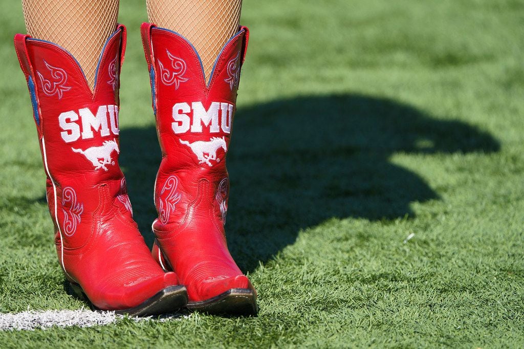 SMU cheerleaders cast a shadow before an NCAA football game against Temple at Ford Stadium on Oct. 19, 2019, in Dallas.