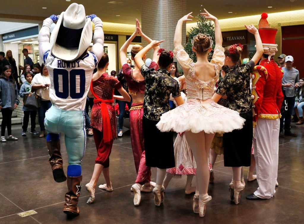 Dallas Cowboys mascot Rowdy, left, poses with dancers with the Texas Ballet Theater at...