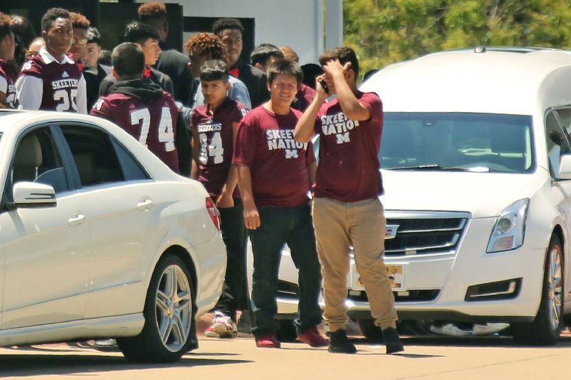 Mesquite High School athletes emerge from the funeral for Jordan Edwards, the 15-year-old...