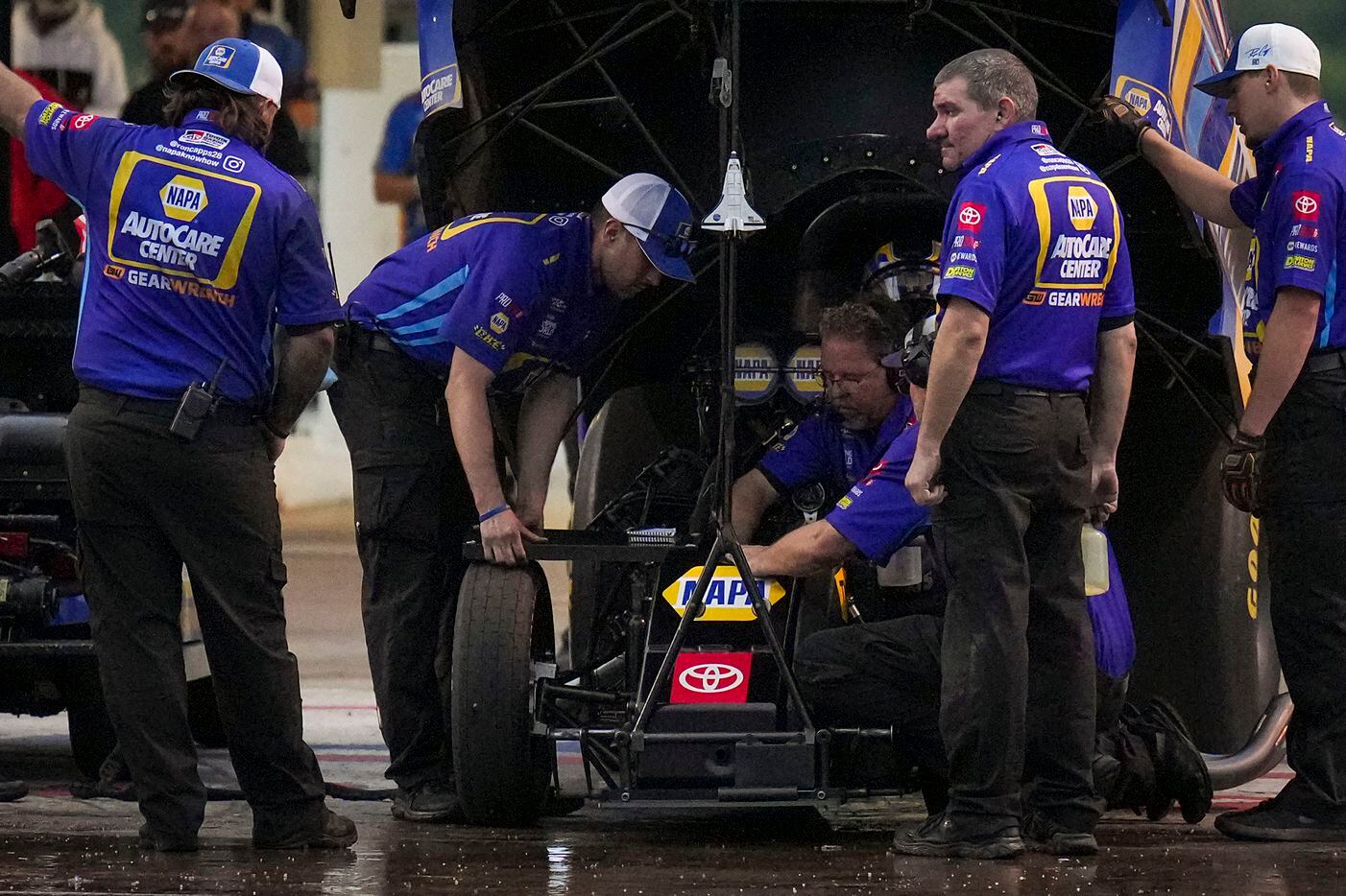 Ron Capps’ crew prepares for the start of his	Funny Car finals victory over Matt Hagan at...