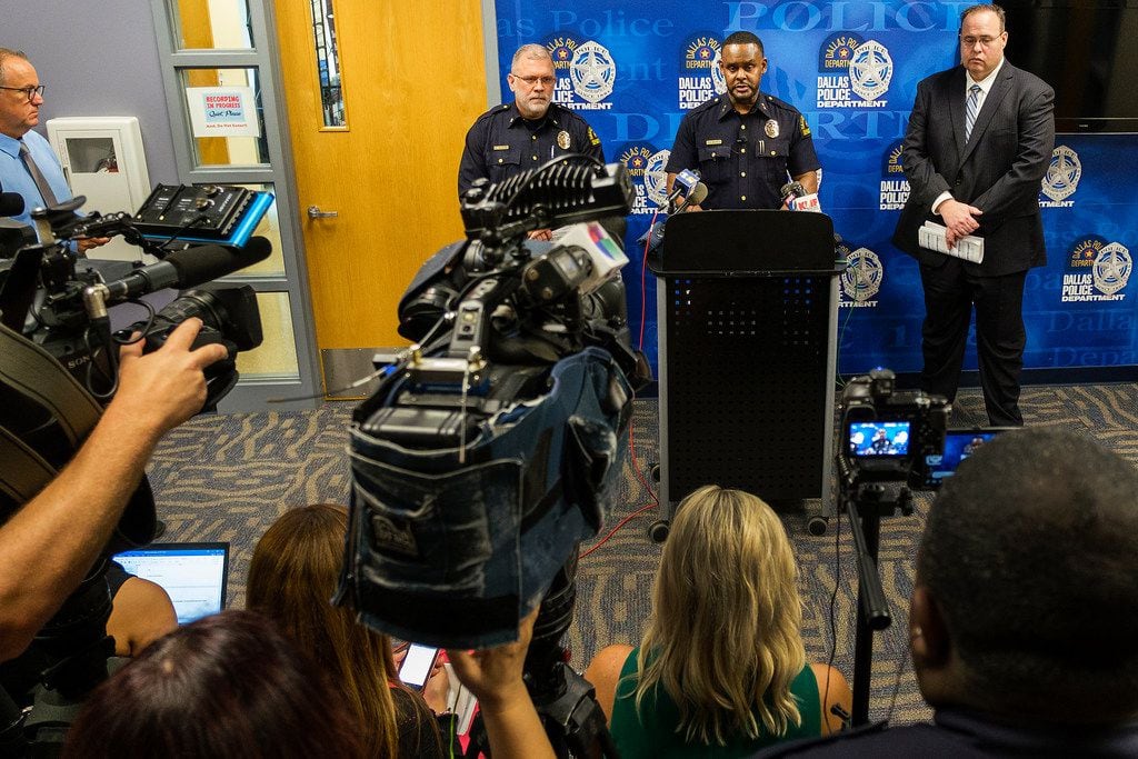 Dallas Police Deputy Chief Avery Moore addresses a press conference regarding overnight homicides on Friday, May 31, 2019, in Dallas. Beside him are Maj. Max Geron (left) and Lt. Lance Hunter. (Smiley N. Pool/The Dallas Morning News)