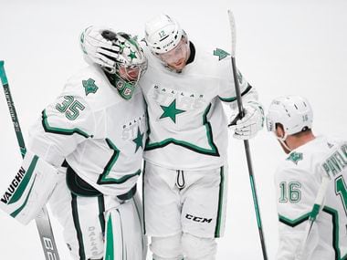 Dallas Stars goaltender Anton Khudobin (35) is congratulated by forwards Radek Faksa (12) and Joe Pavelski (16) after a shootout in an NHL hockey game against the Detroit Red Wings in Dallas, Monday, April 19, 2021. Dallas won 3-2 in a shootout. (Brandon Wade/Special Contributor)