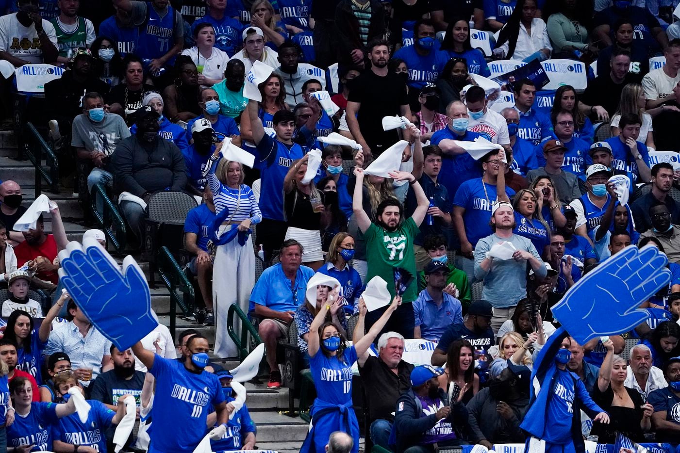 Dallas Mavericks fans try to distract a LA Clippers free throw shooters during the first...