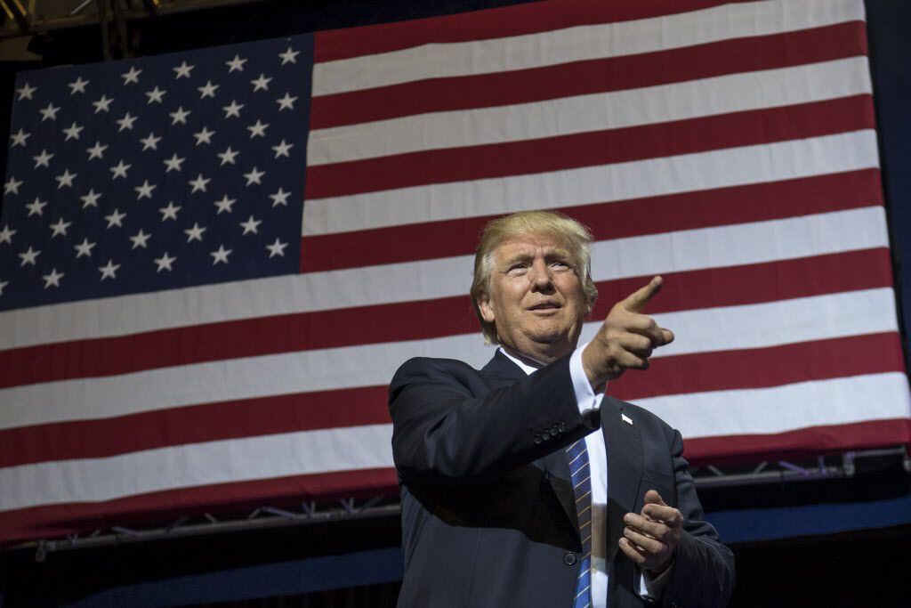 Donald Trump, 2016 Republican presidential nominee, gestures as he arrives on stage during a...