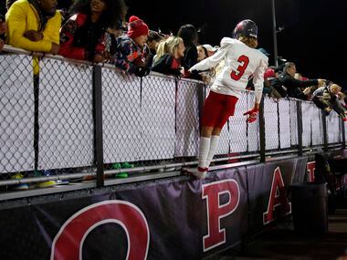 Frisco Liberty receiver Preston Urbine (3) celebrates with fans in the stands following the...