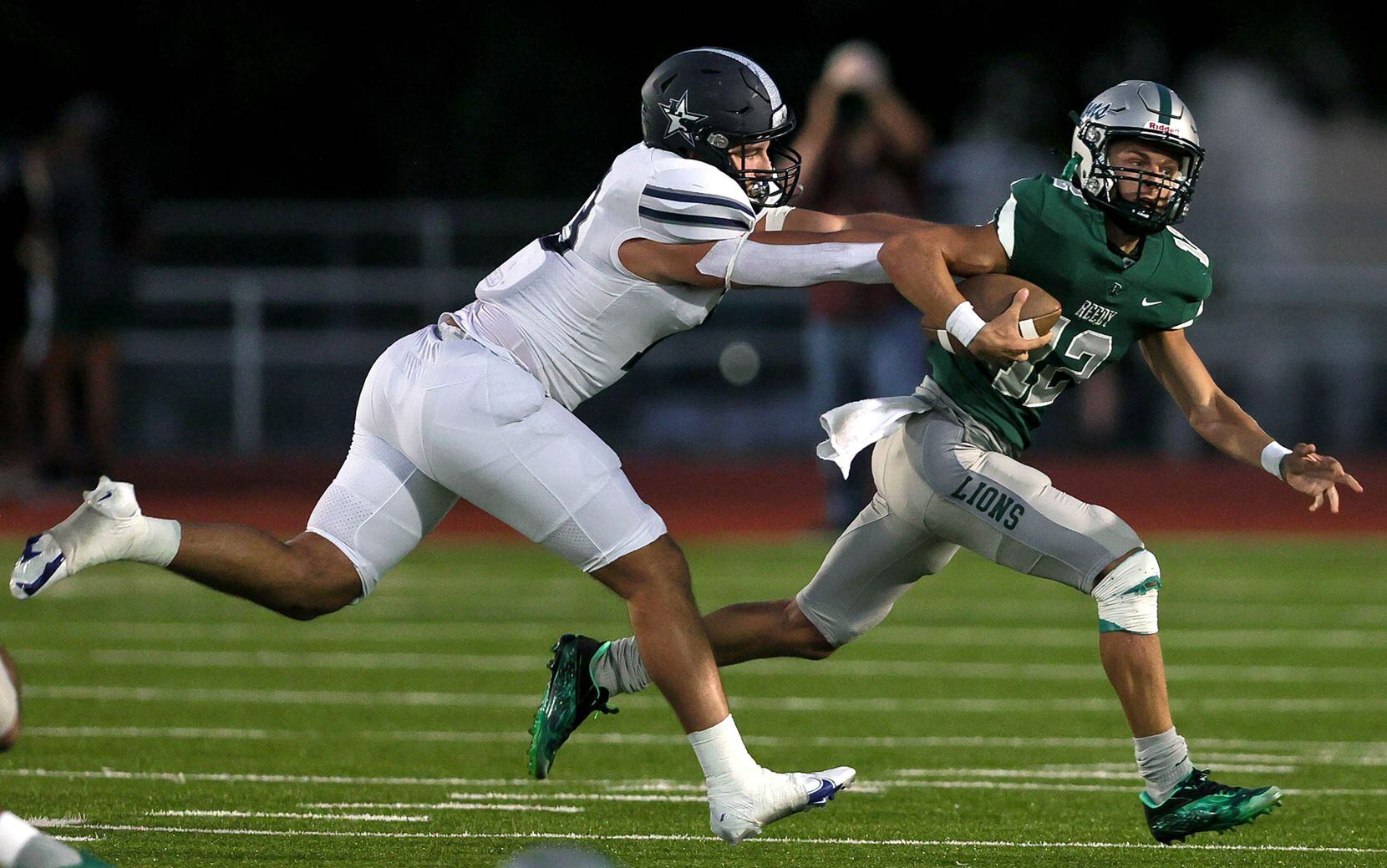 Frisco Reedy quarterback Caleb Deal (12) tries to avoid a sack from Frisco Lone Star...