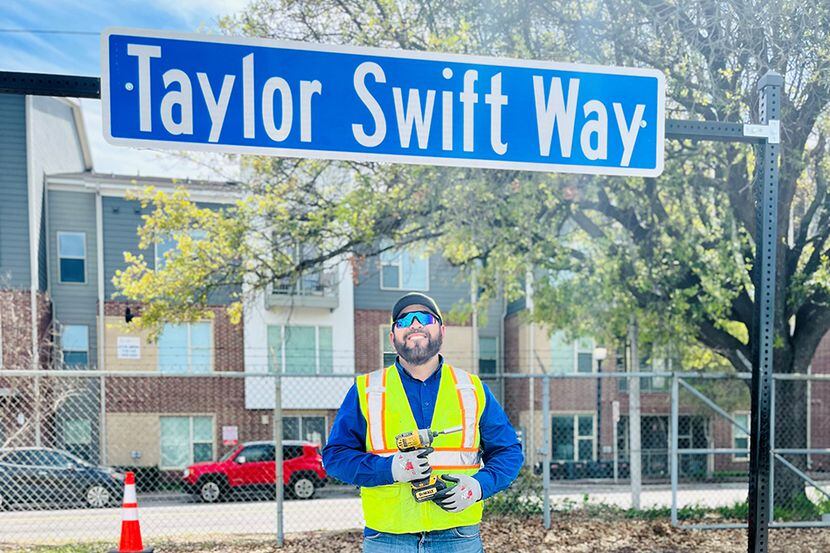 Fans are invited to take a photo in front of the Taylor Swift Way honorary street sign,...