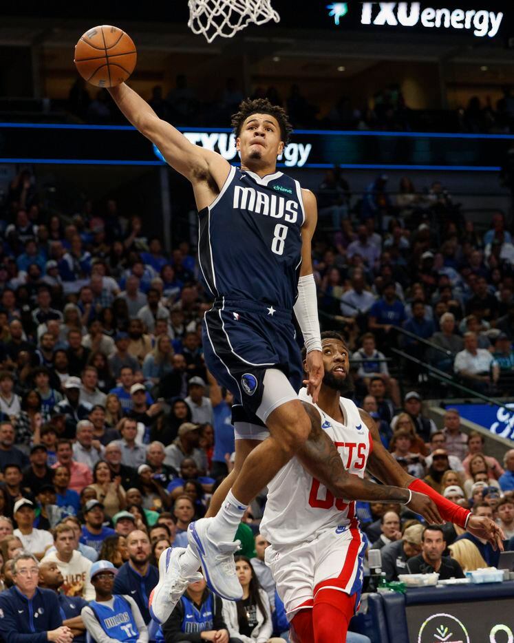 Dallas Mavericks guard Josh Green (8) dunks the ball over Brooklyn Nets forward Royce...