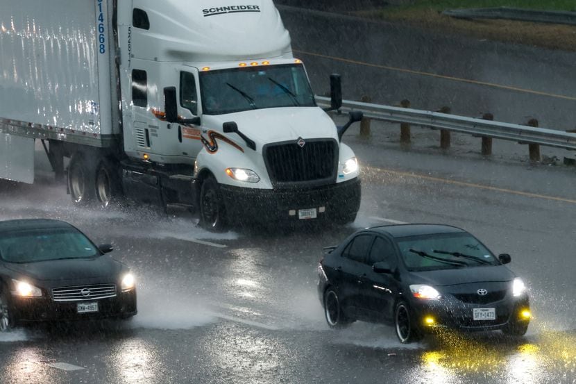Drivers move along Interstate 35E in heavy rain on Thursday, March 16, 2023. Much of the...
